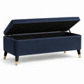Banc de rangement en velours bleu avec pieds en métal et bois